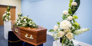 Funeral service flowers and coffin